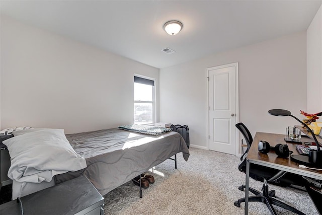 bedroom with light carpet