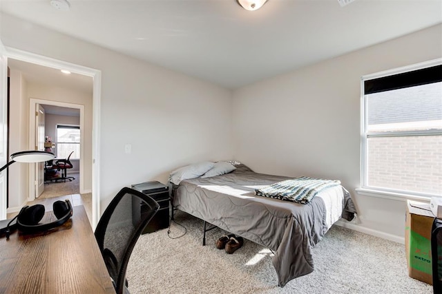 bedroom with light colored carpet