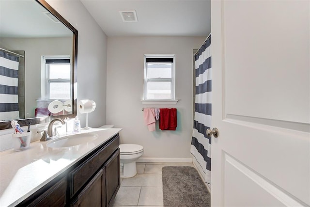 bathroom with toilet, tile patterned flooring, and vanity