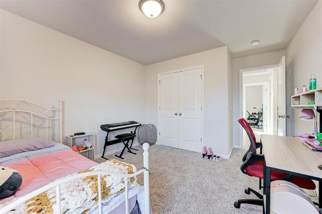 bedroom with a closet and light colored carpet