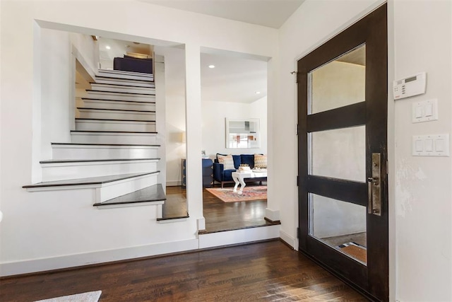 staircase featuring hardwood / wood-style floors