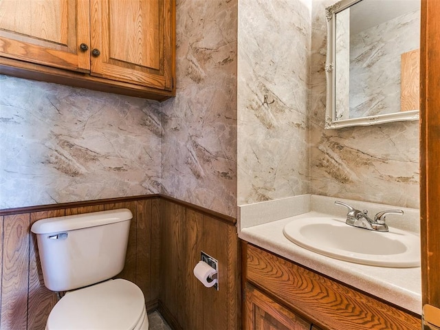 bathroom with toilet and vanity