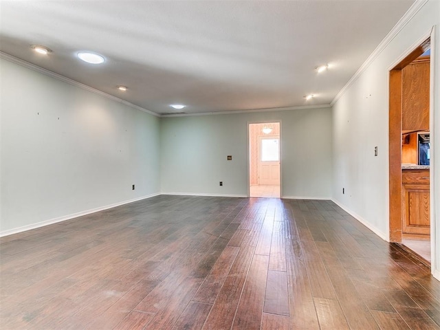 unfurnished room with dark hardwood / wood-style flooring and ornamental molding