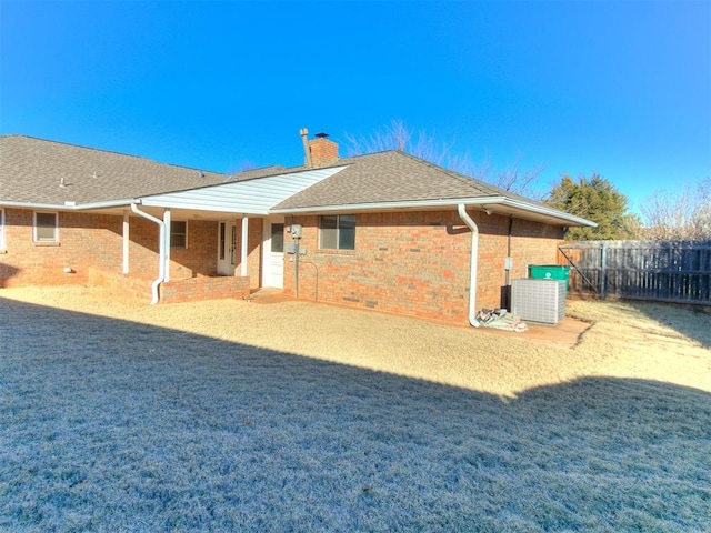 back of house featuring central AC unit and a patio