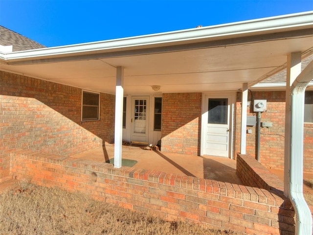 entrance to property featuring a patio