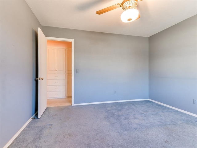 empty room with light carpet and ceiling fan