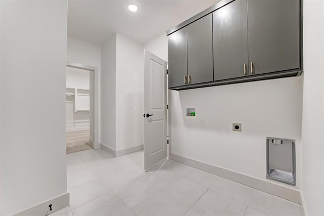 laundry area featuring washer hookup, cabinets, and hookup for an electric dryer