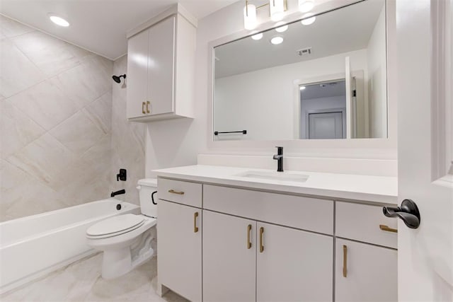 full bathroom featuring vanity, toilet, and tiled shower / bath combo