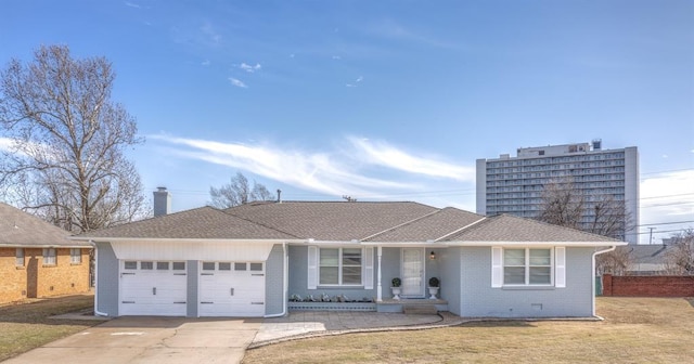 ranch-style home featuring a garage and a front yard