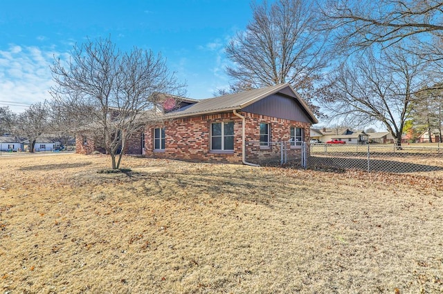 view of side of property with a yard