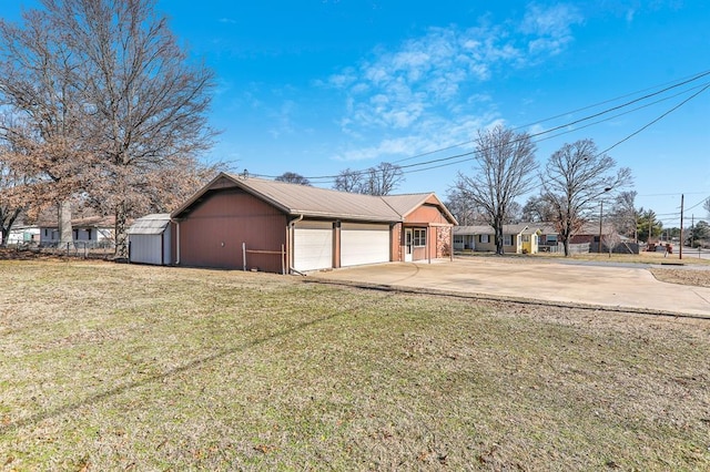 garage featuring a lawn