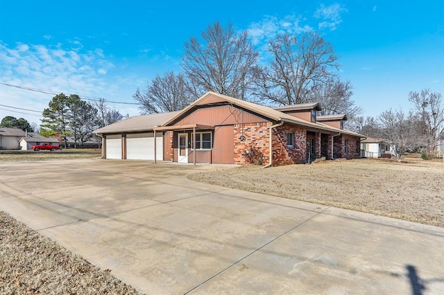 view of property exterior featuring a garage and a yard