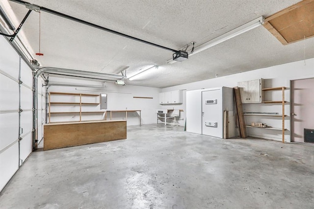 garage with a garage door opener and electric panel