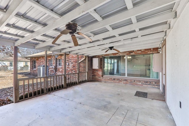 unfurnished sunroom with ceiling fan