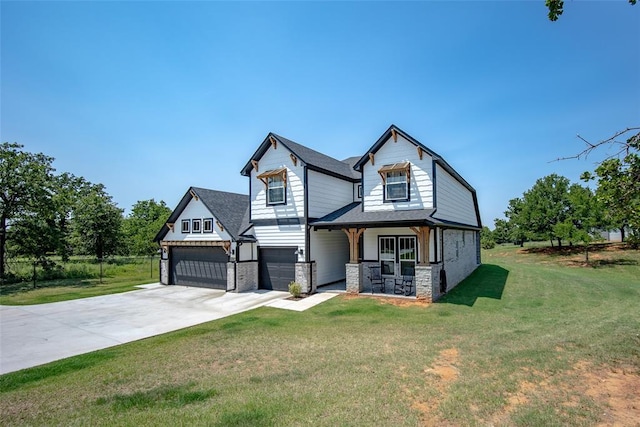 view of front of home featuring a front yard and a garage