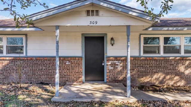 doorway to property with a patio area