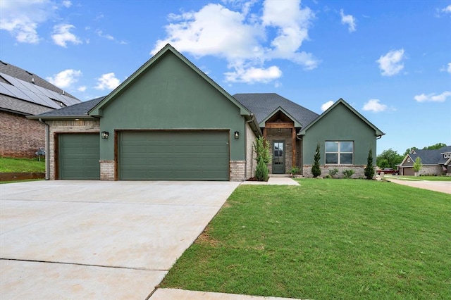 view of front of house with an attached garage, driveway, a front yard, and stucco siding