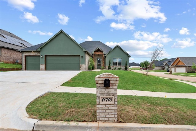view of front of house featuring concrete driveway, stucco siding, a front lawn, and a garage