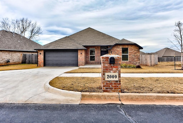 ranch-style home featuring a garage