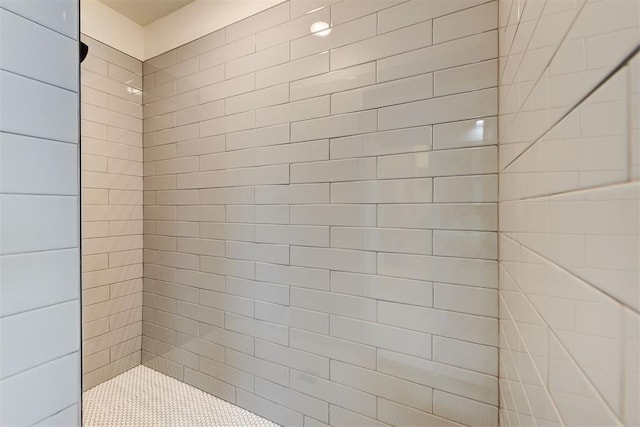 bathroom with tiled shower