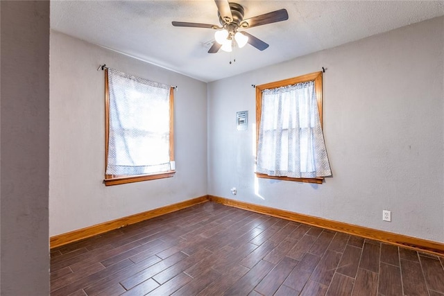 spare room with a textured ceiling and ceiling fan