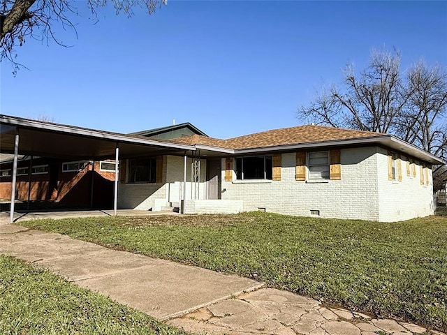 view of front of property with crawl space, an attached carport, a front lawn, and brick siding