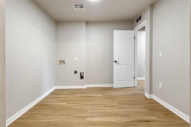 laundry room featuring laundry area, hookup for a washing machine, visible vents, and electric dryer hookup