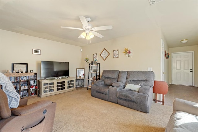 living room featuring ceiling fan and light colored carpet