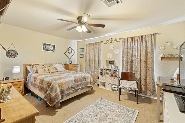 bedroom featuring ceiling fan and light colored carpet