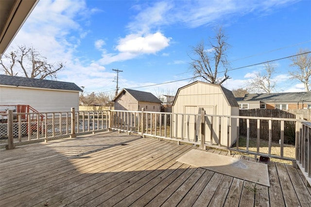 wooden terrace featuring a storage unit