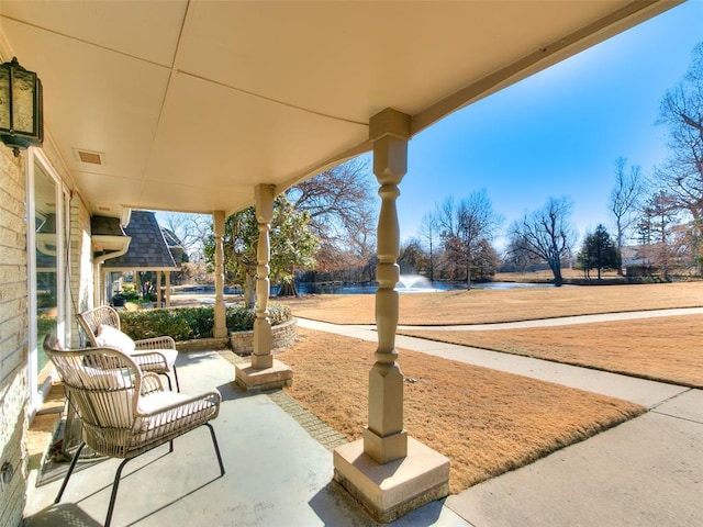 view of patio / terrace featuring a water view