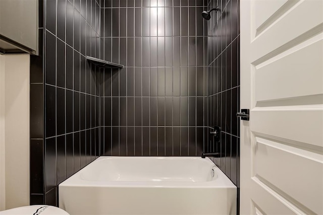 bathroom with toilet and bathtub / shower combination