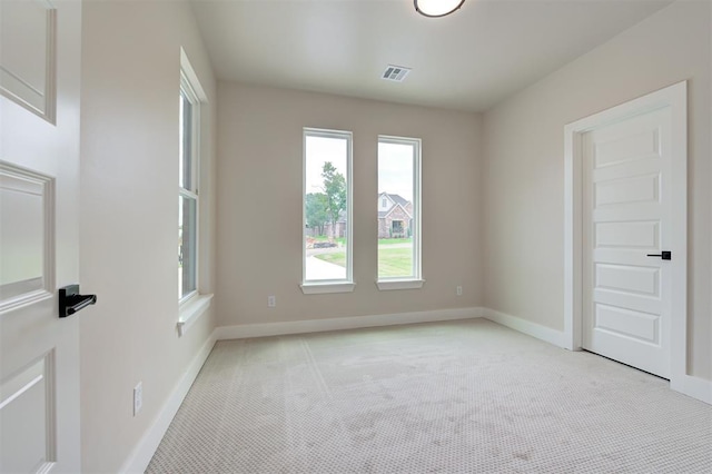 view of carpeted spare room
