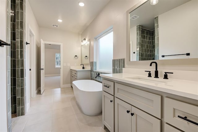 bathroom featuring vanity, separate shower and tub, and tile patterned flooring