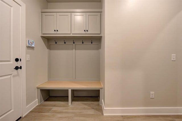 mudroom with light hardwood / wood-style flooring