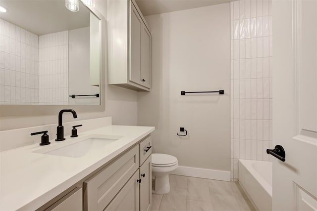 full bathroom with vanity, tiled shower / bath, and toilet