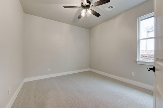 spare room with carpet flooring and ceiling fan