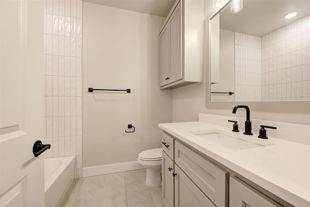 full bathroom featuring tiled shower / bath combo, vanity, and toilet