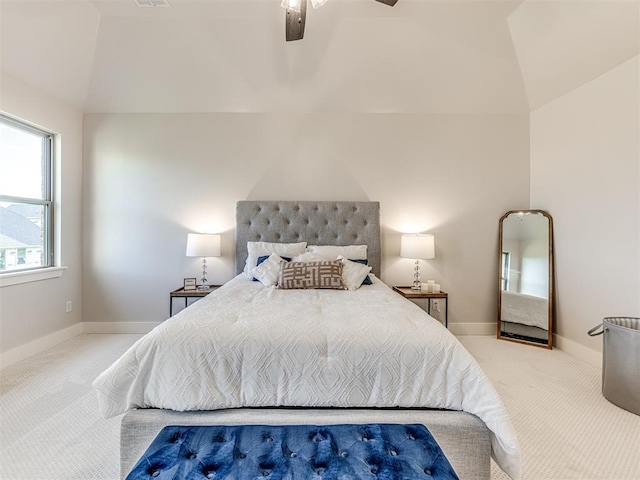 bedroom featuring ceiling fan, light colored carpet, and lofted ceiling