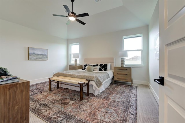 carpeted bedroom with ceiling fan and lofted ceiling