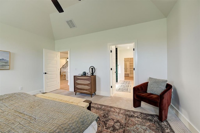 carpeted bedroom featuring ceiling fan, connected bathroom, and high vaulted ceiling