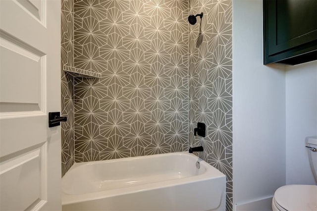 bathroom featuring toilet and bathtub / shower combination