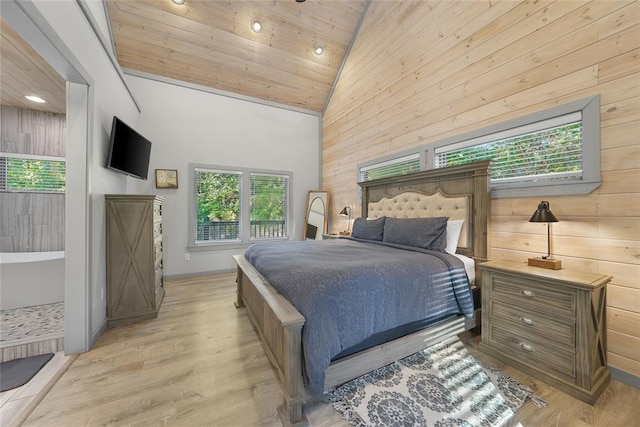 bedroom with high vaulted ceiling, wooden ceiling, wooden walls, and light wood-type flooring