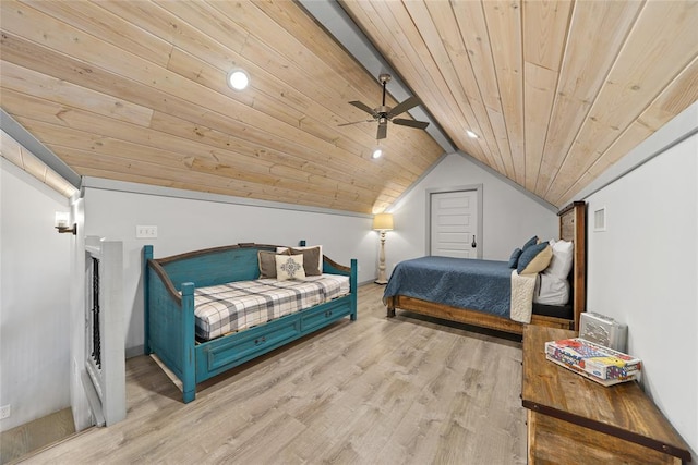 bedroom with lofted ceiling, ceiling fan, light hardwood / wood-style floors, and wooden ceiling