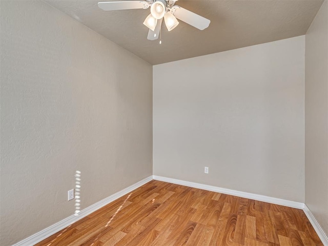 spare room with ceiling fan and light hardwood / wood-style flooring