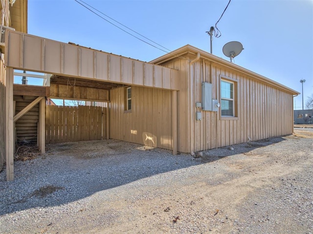 view of home's exterior with a carport