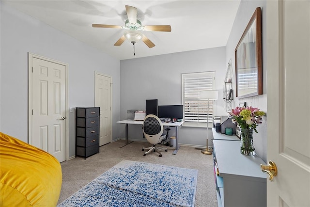 home office with light colored carpet and ceiling fan