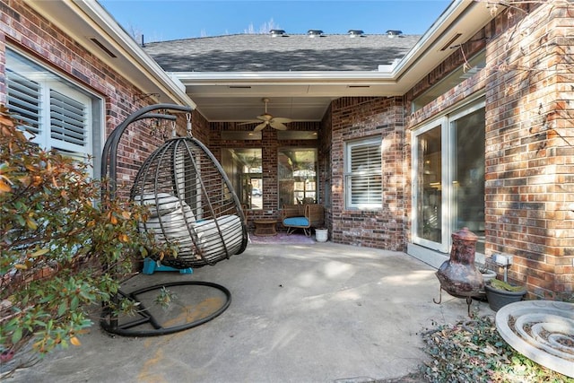 view of patio featuring ceiling fan