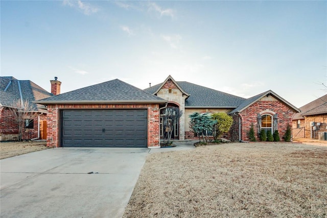 ranch-style home with a garage and a front yard