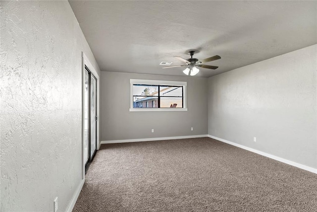 unfurnished bedroom featuring ceiling fan and carpet floors